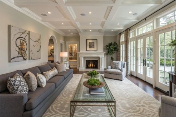 long living room decor with a fireplace and large windows